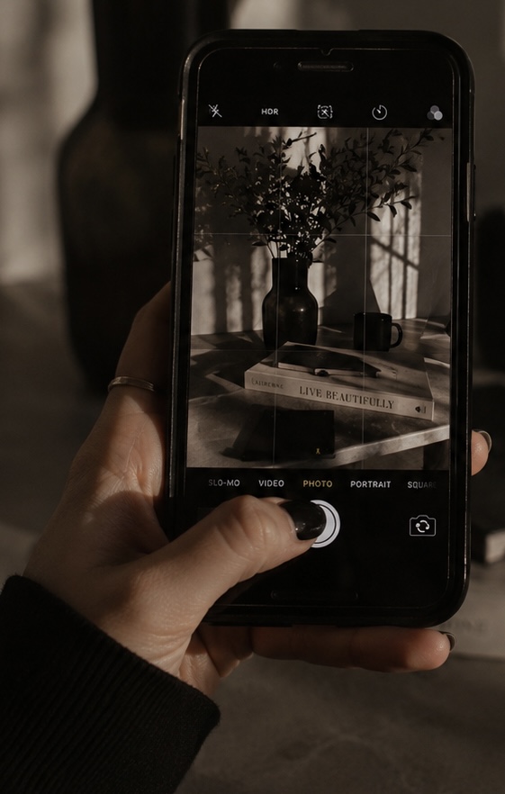 Phone camera composing a branded lifestyle social media image